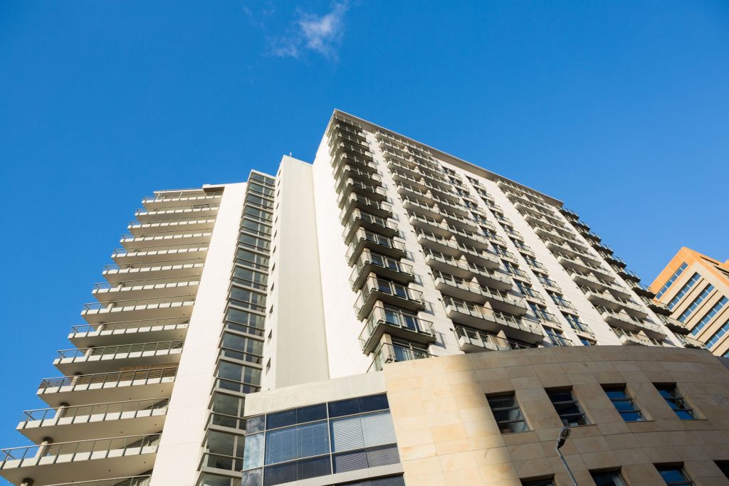 High-rise apartment building with balconies.