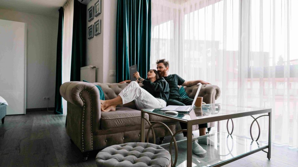 Couple enjoying apartment living in Kerala indoors