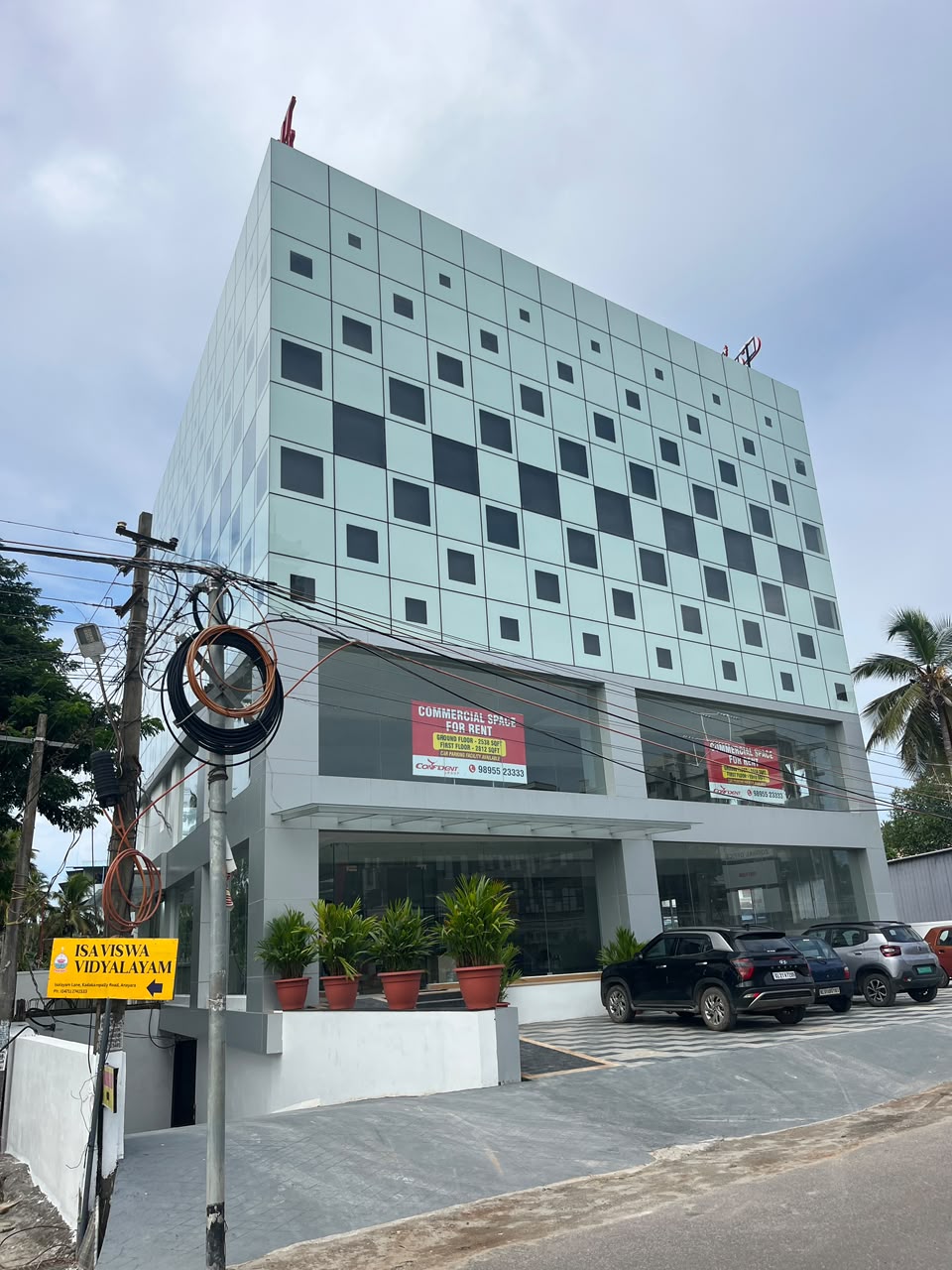 Commercial building side elevation with car parking